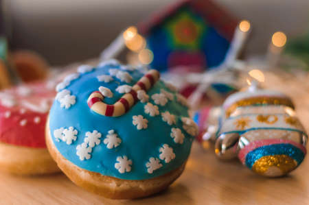 Christmas cakes on the table with tangerinesの写真素材
