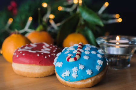 Christmas cakes on the table with tangerinesの写真素材