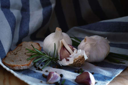 garlic black bread rosemary on a towelの写真素材