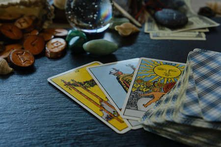 wooden runes from the Tarot card on the tableの写真素材