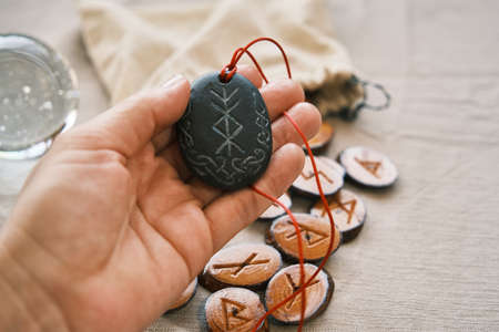 rune stone good luck and riches talisman with runescript