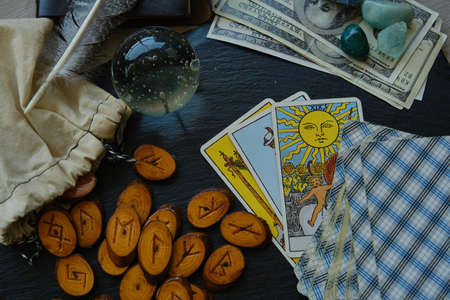 wooden runes from the Tarot card on the tableの写真素材