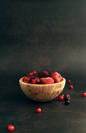 assorted wild red berries in a Cupの写真素材