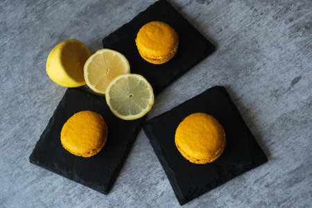 yellow lemon macaroni cookies on a gray backgroundの写真素材