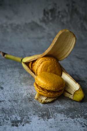 yellow macaroni cookies on a gray background with a banana