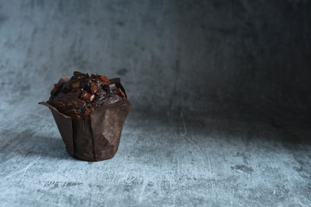 chocolate muffins on a dark backgroundの写真素材