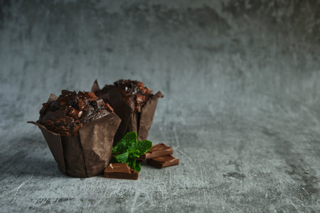 chocolate muffins on a dark backgroundの写真素材
