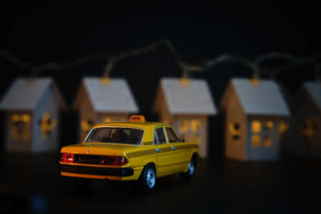 toy car on the background of housesの写真素材