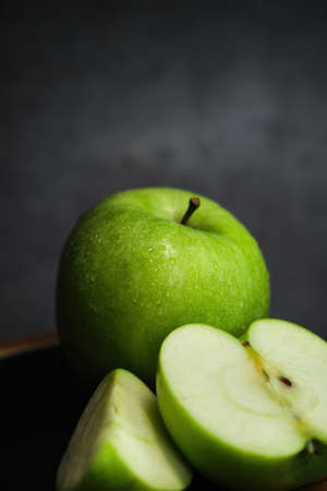 green apple on the black backgroundの写真素材