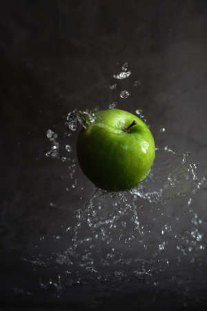 green apple in the sprayの写真素材