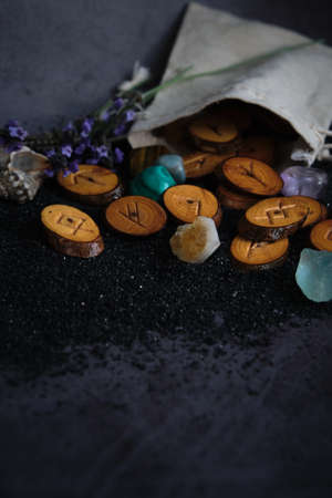 homemade wooden runes on a dark background