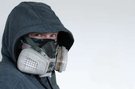a man in a respiratory mask in a jacket with a hoodのeditorial素材
