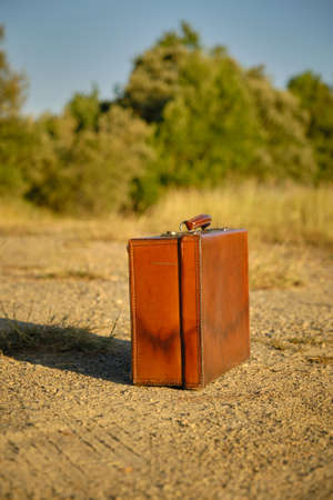 an old vintage suitcase on the groundの写真素材