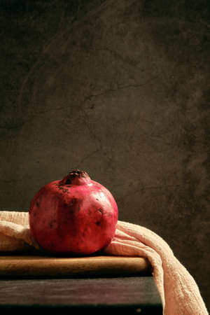 ripe pomegranate on the tableの写真素材
