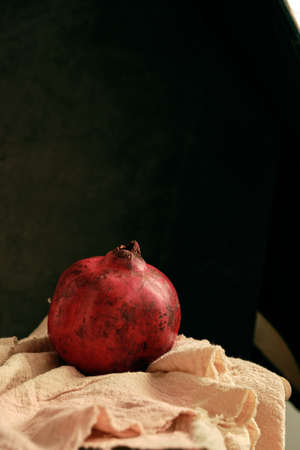 ripe pomegranate on the tableの写真素材