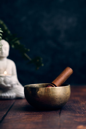 Tibetan bowl on a dark backgroundの写真素材