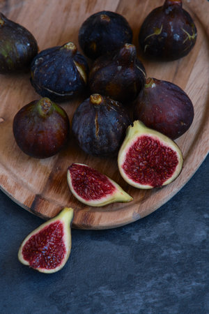 still life figs on a wooden plateの写真素材