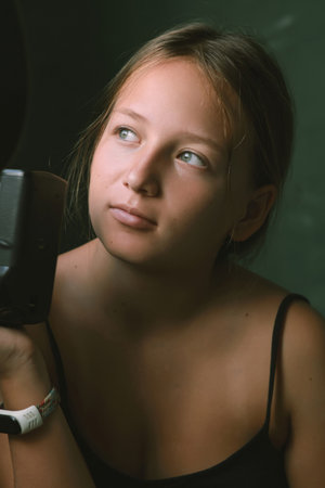 little girl with photo cameraの写真素材