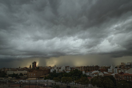 Storm clouds with streaks of light over the city