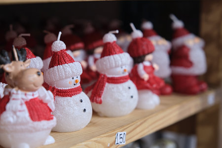 Snowman figures in the form of a candleの写真素材