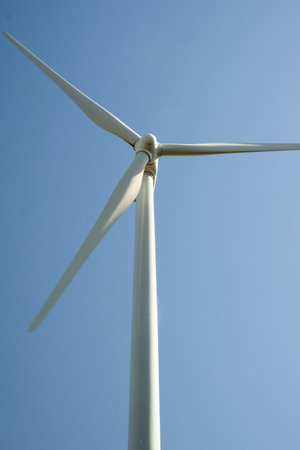 close up Wind turbine with blue sky at background