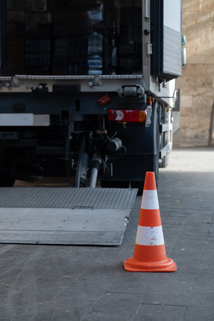 white-red construction cone on the roadの写真素材