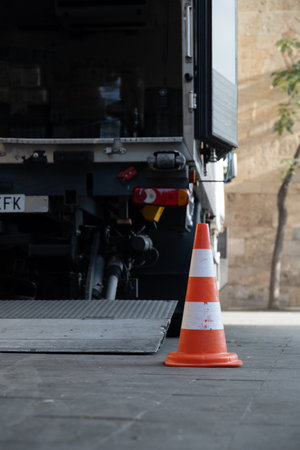 white-red construction cone on the roadの写真素材