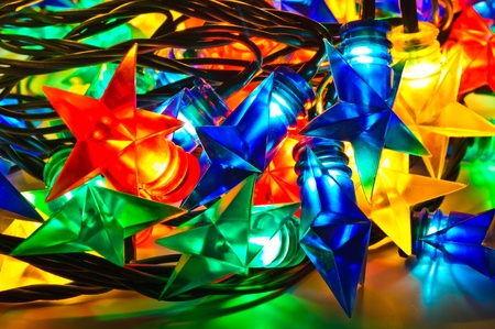 Garland of colored lights for Christmas trees. Spread out to a tableの写真素材