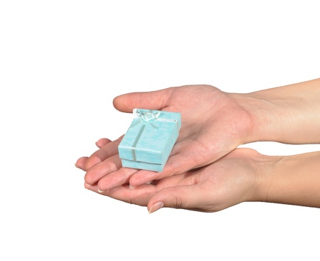 Hand with gift box. Isolated on white backgroundの写真素材