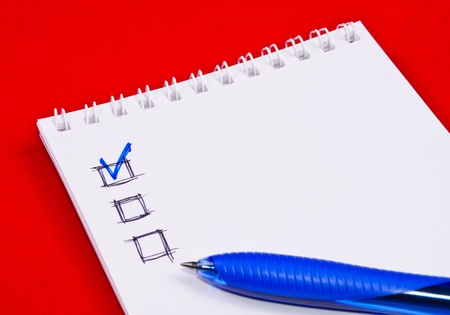 Pad of paper to take notes. Photo on a colored backgroundの写真素材