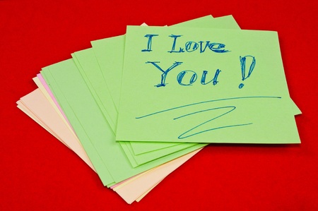 Colored stickers with the text. On a red backgroundの写真素材