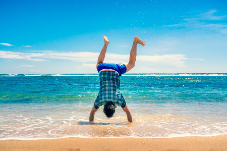 Travel and Vacation concept. Happy young man having fun outdoors. Joyful man. Summer. Holidaysの写真素材
