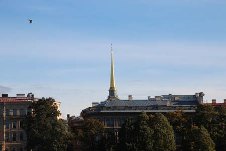 View to admiralty spire against blue sky . Saints-Petersburg