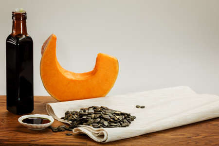Delicious pumpkin slice, pumpkin seeds and pumpkin oilの写真素材