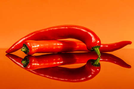 hot pepper on an orange backgroundの写真素材