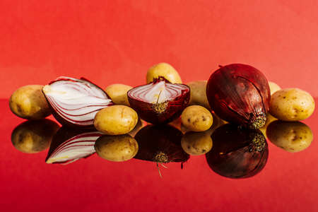 red onion, tomatoes, oyster mushrooms and potatoesの写真素材