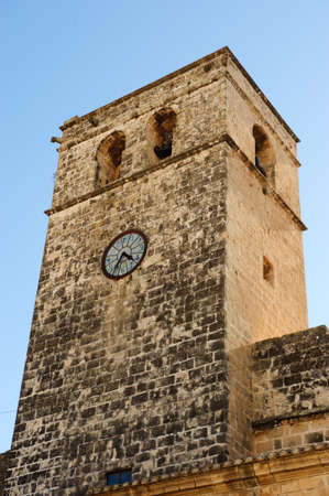 Church bell tower in Jvea, Spainの写真素材