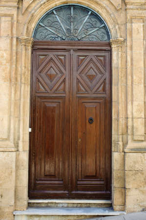 Wooden door in a mediterranean houseの写真素材