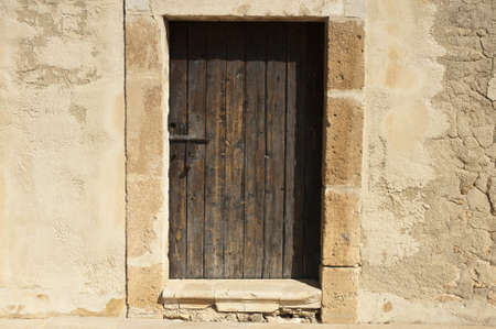 Wooden door in a mediterranean castleの写真素材