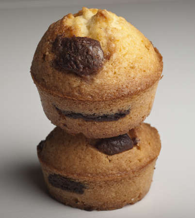 Muffin with chocolate on a wooden tableの写真素材