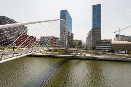 BILBAO-JULY 19  Zubizuri Bridge, Santiago Calatrava in Bilbao, Spain, on July 19, 2013  It is an arch bridge that hangs over Nervion riverのeditorial素材