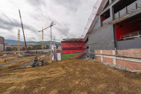 BILBAO, SPAIN - SEPTEMBER 18  Workers removing the land to build the last tier of the football stadium of San Mames in Bilbao, Spain, on September 18, 2013  The architect of this project is Cesar Azkarate のeditorial素材