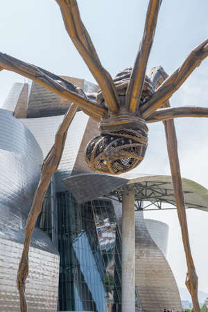 BILBAO, SPAIN- JULY 19  Bronze sculpture, steel and marble, seen from below, and located at the rear of the Guggenheim Museum Bilbao, Spain, on July 19, 2013  It is the most visited tourist siteのeditorial素材