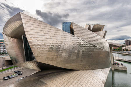 BILBAO, SPAIN - OCTOBER 1  Exterior of The Guggenheim Museum and Iberdrola Tower on October 1, 2013 in Bilbao, Spain  The Guggenheim is a museum of modern and contemporary art designed by Canadian-American architect Frank Gehry on October 1, 2013 in Bilbaのeditorial素材