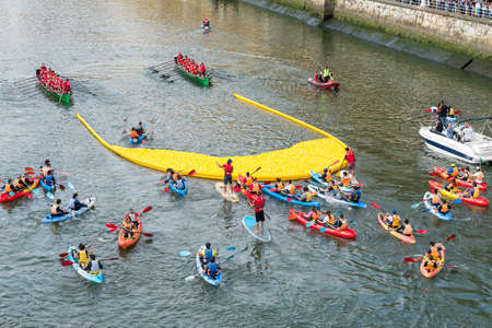 BILBAO, SPAIN - OCTOBER 13   Two ships carrying plastic ducks to the finish line during the competition organized by the foundation Walk on Project  WOPATO  on October 13, 2013 in Bilbao, Spain のeditorial素材