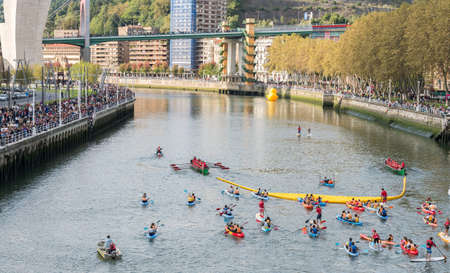 BILBAO, SPAIN - OCTOBER 13   Two ships carrying plastic ducks to the finish line during the competition organized by the foundation Walk on Project  WOPATO  on October 13, 2013 in Bilbao, Spain のeditorial素材