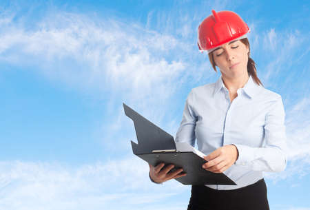 Architect woman over clouds background. Reading upset