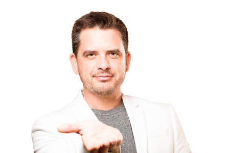 Man wearing a white jacket. Holding gesture.の写真素材