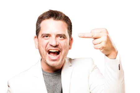 Man wearing a white jacket. Doing rocker gesture.の写真素材