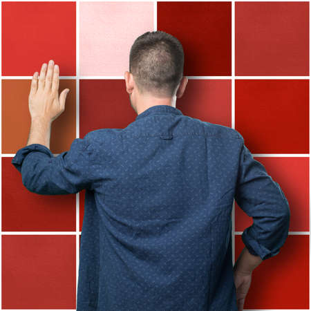 Young man wearing a blue outfit. Doing stop gesture.の写真素材
